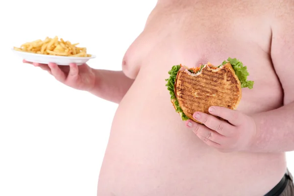 Kövér férfi, gazdaság, szendvics, sült krumpli elszigetelt fehér — Stock Fotó