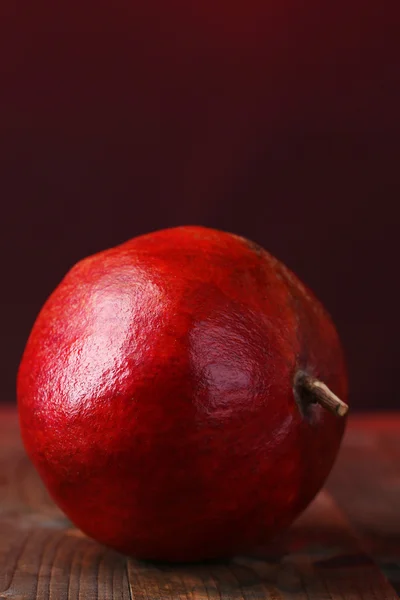 Ripe pomegranate on dark color  background — Stock Photo, Image
