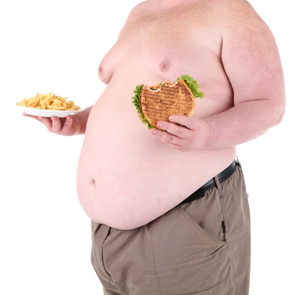 Fat man holding sandwich and fried potato, isolated on white Stock Picture