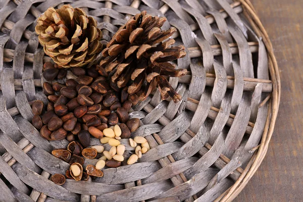 Cedar pine nuts on wooden table — Stock Photo, Image