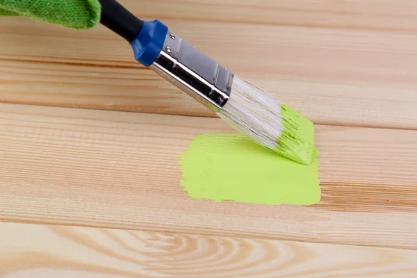 Brush painting wooden furniture, close up — Stock Photo, Image