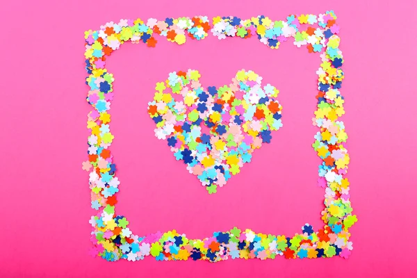 Confetti on pink background — Stock Photo, Image