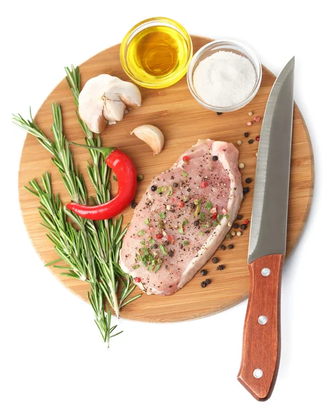 Raw meat steak with herbs and spices on cutting board, isolated on white — Stock Photo, Image