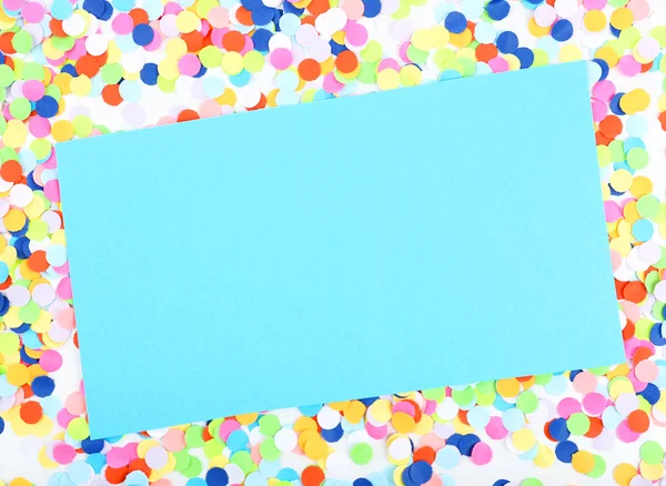 Blanco papier met confetti rond — Stockfoto