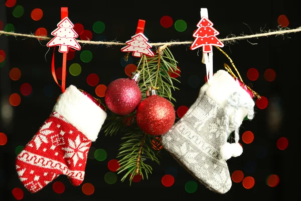 Christmas accessories on black background with lights — Stock Photo, Image