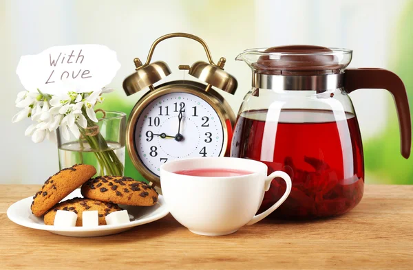 Tasty herbal tea and cookies on wooden table — Stock Photo, Image