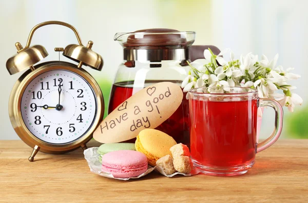 Tasty herbal tea and cookies on wooden table — Stock Photo, Image