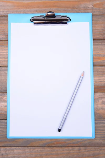 Clipboard on wooden background — Stock Photo, Image