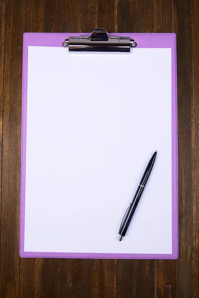 Clipboard on wooden background — Stock Photo, Image