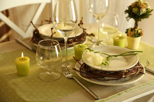 Beautiful holiday Easter table setting in green tones, on bright background — Stock Photo, Image