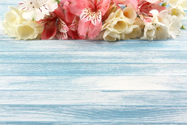 Beautiful Alstroemeria flowers on wooden table — Stock Photo, Image