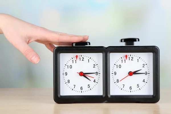 Hand pushing chess clock, close up — Stock Photo, Image