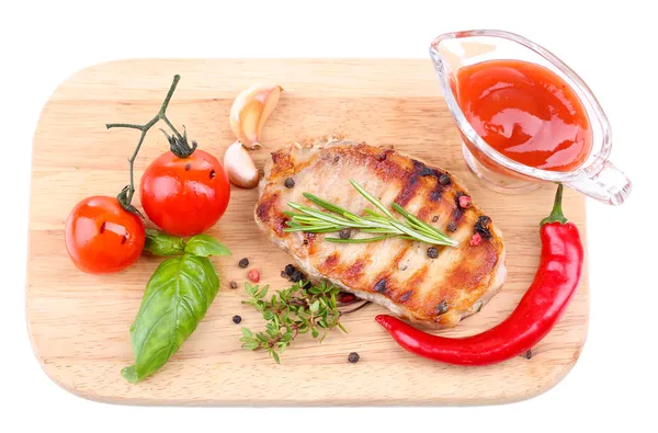 Grilled steak with spices, herbs and vegetables  on wooden board, isolated on white — Stock Photo, Image