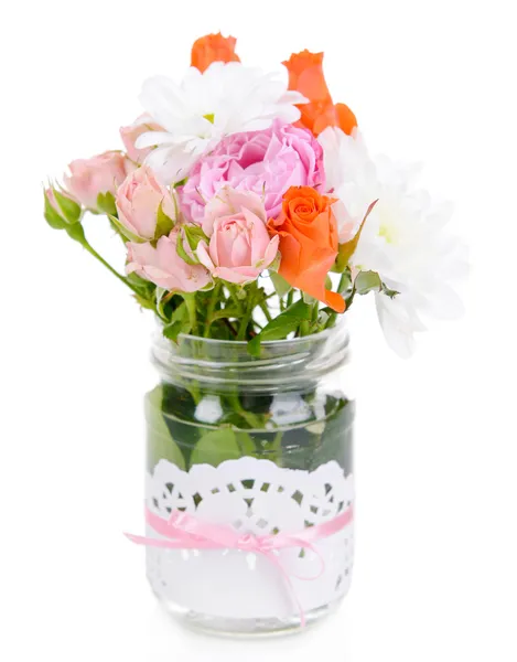 Beautiful bouquet of bright flowers in jar isolated on white — Stock Photo, Image