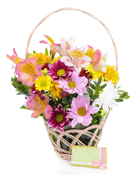 Beautiful bouquet of bright flowers in wicker basket isolated on white — Stock Photo, Image