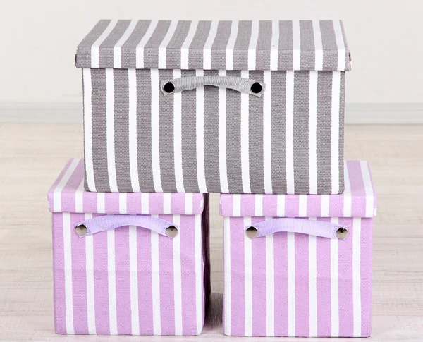 Textile boxes on floor in room — Stock Photo, Image