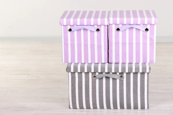 Textile boxes on floor in room — Stock Photo, Image