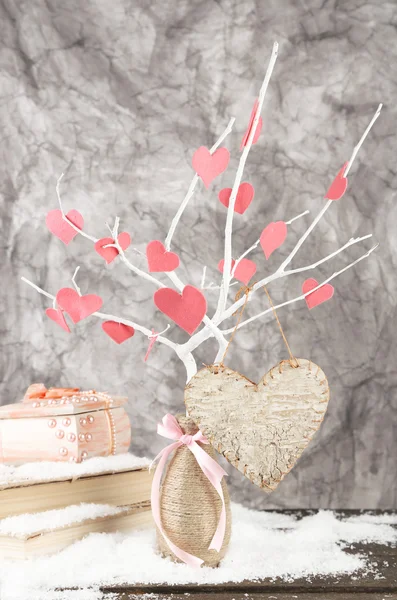 Decorative branch with hearts, on grey background — Stock Photo, Image
