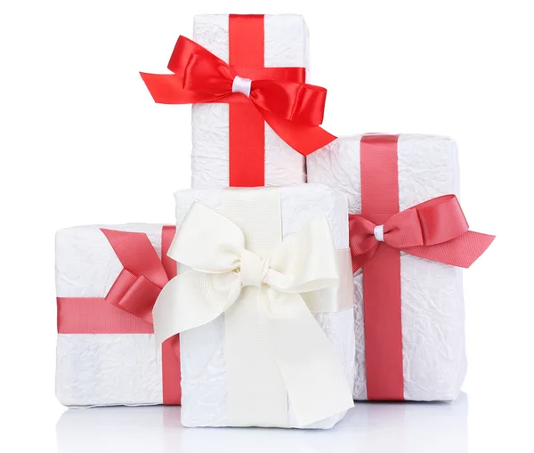 Beautiful gifts with red ribbons, isolated on white — Stock Photo, Image