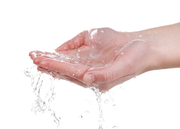 Human hands with water splashing on them isolated on white