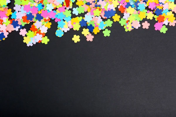 Confetti on black background — Stock Photo, Image