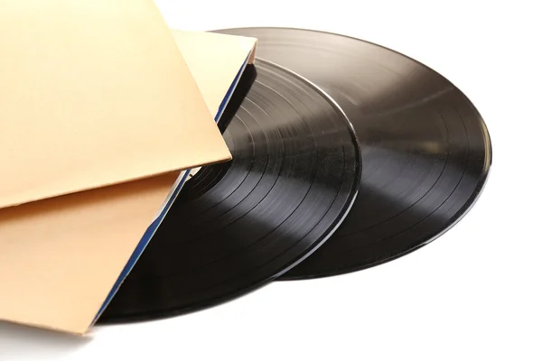 Gamla vinylskivor i papper fall, isolerad på vit — Stockfoto