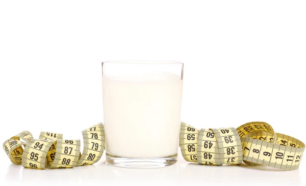 Glass of milk with measuring tape isolated on white — Stock Photo, Image