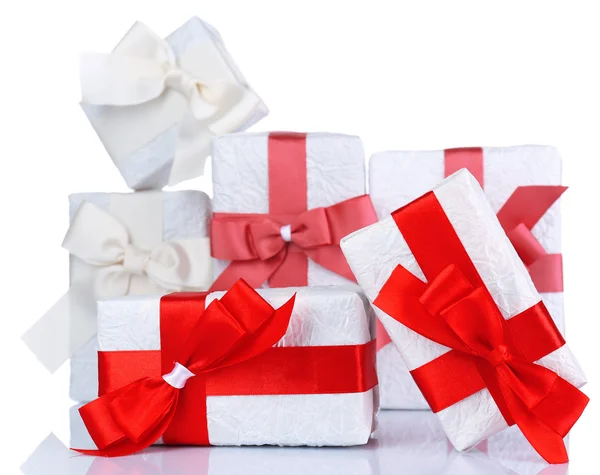 Beautiful gifts with red ribbons, isolated on white — Stock Photo, Image