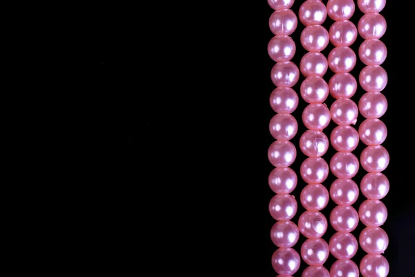 Beautiful pearls on black background — Stock Photo, Image