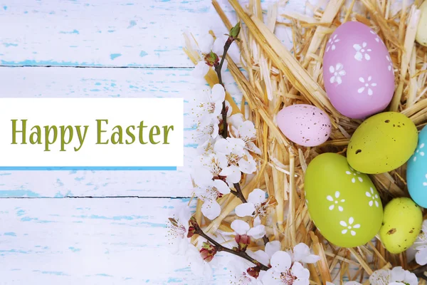 Easter composition with flowering branches on wooden table close-up — Stock Photo, Image