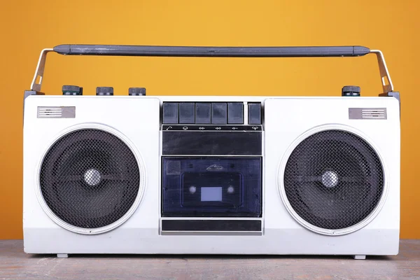 Retro cassette stereo recorder on table on yellow background — Stock Photo, Image