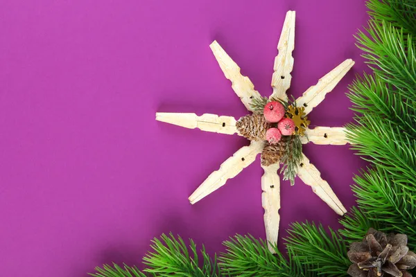 Beautiful snowflake with fir branch on purple background — Stock Photo, Image