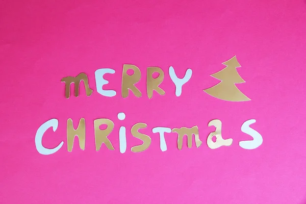 Feliz Natal lettering no fundo rosa — Fotografia de Stock