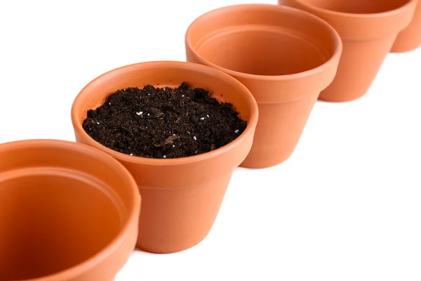 Pots et terre de fleurs d'argile, isolés sur blanc — Photo