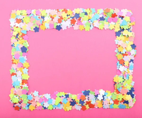 Confetti frame on pink background — Stock Photo, Image