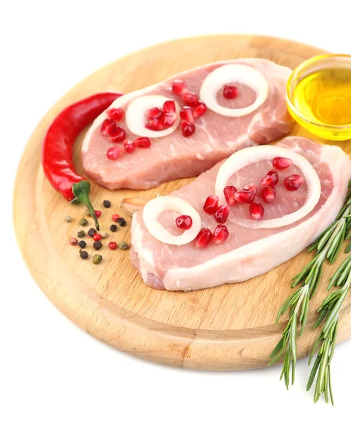 Raw meat steak with herbs, spices, onion rings on cutting board, isolated on white — Stock Photo, Image