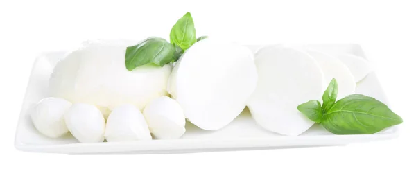 Tasty mozzarella cheese with basil on plate isolated on white — Stock Photo, Image