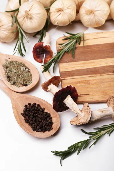 Different spices and cutting board, isolated on white — Stock Photo, Image