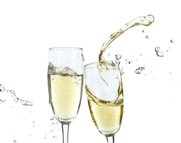 Glasses of champagne with splash, isolated on white — Stock Photo, Image