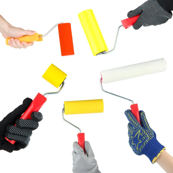 Rouleaux de peinture dans les mains isolés sur blanc — Photo