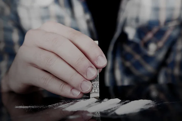 Drug abuse concept - man snorting cocaine — Stock Photo, Image