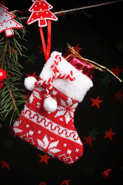 Santa sock and Christmas accessories on black background with lights — Stock Photo, Image