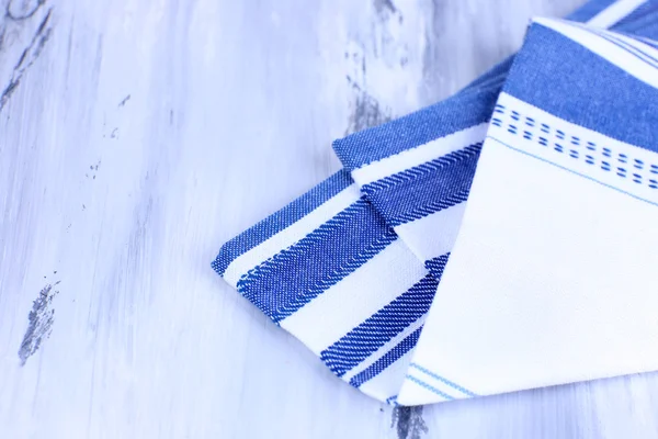 Kitchen towels on wooden background