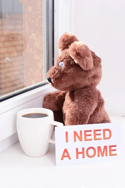 Toy-bear looking out window close-up — Stock Photo, Image