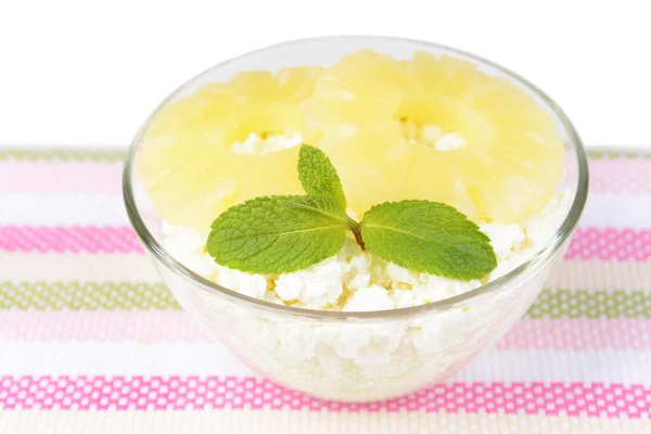 Bowl of tasty cottage cheese with pineapple, isolated on white — Stock Photo, Image