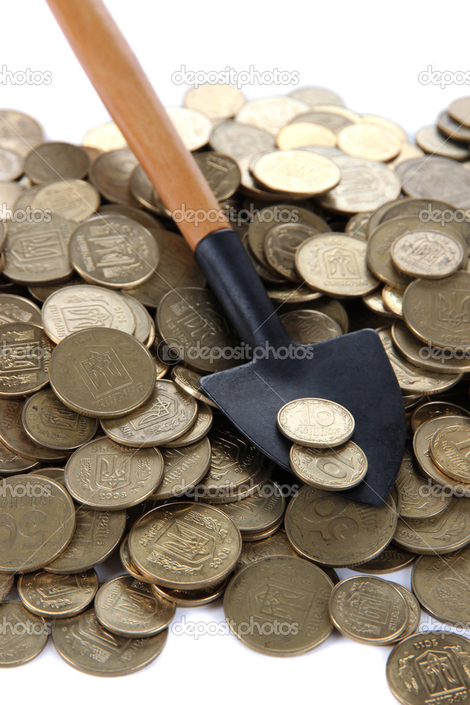 Coins with shovel close up