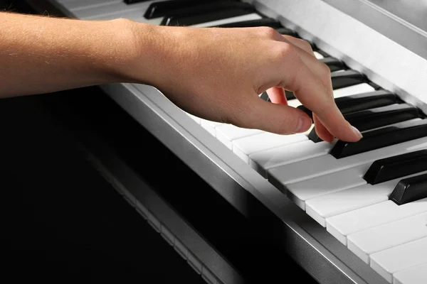 Hand of woman playing synthesizer — Stock Photo, Image