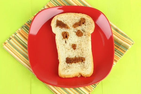 Funny toast, on color wooden background — Stock Photo, Image