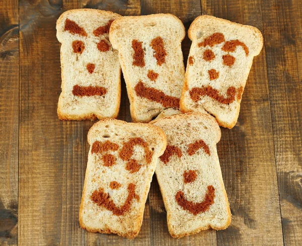 Funny toasts, on wooden background — Stock Photo, Image