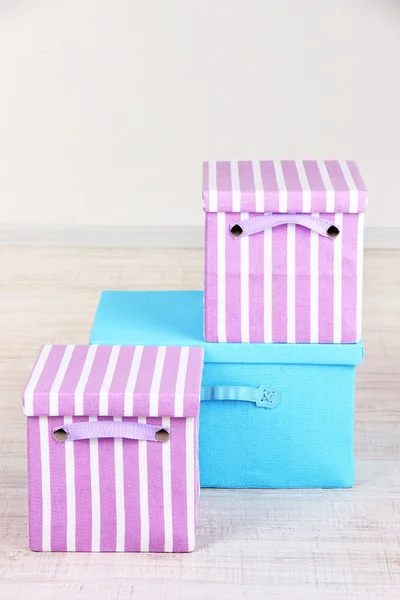 Textile boxes on floor in room — Stock Photo, Image